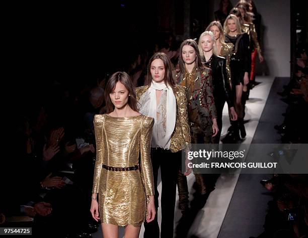 Models present creations by French designer Christophe Decarnin for Balmain during the autumn-winter 2010/2011 ready-to-wear collection show on March...