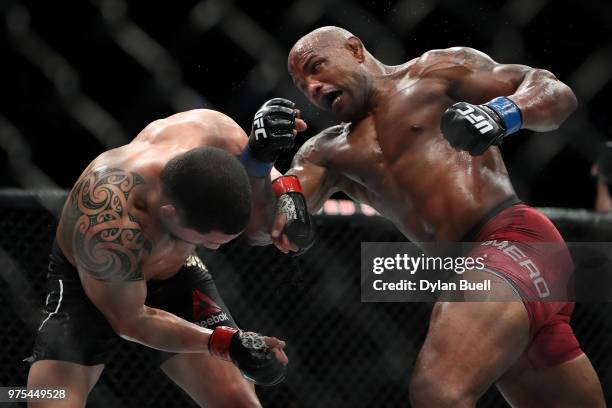 Yoel Romero of Cuba attempts a punch against Robert Whittaker of New Zealand in the third round in their middleweight title fight during the UFC 225:...