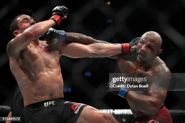 Robert Whittaker of New Zealand and Yoel Romero of Cuba exchange punches in the fifth round in their middleweight title fight during the UFC 225:...