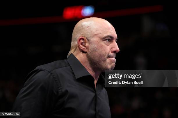 Joe Rogan enters the octagon during the UFC 225: Whittaker v Romero 2 event at the United Center on June 9, 2018 in Chicago, Illinois.