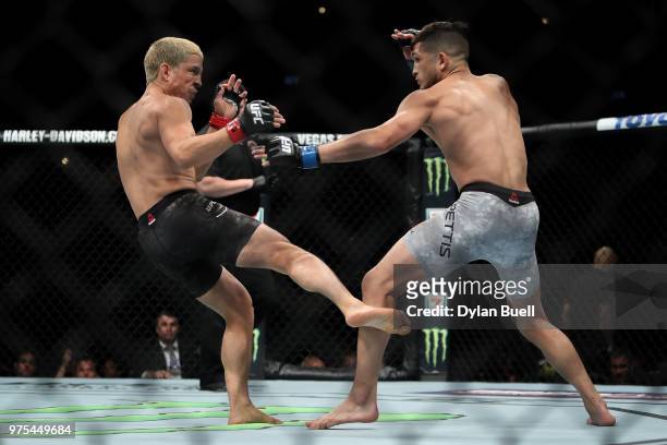 Joseph Benavidez lands a kick on Sergio Pettis in the second round in their flyweight bout during the UFC 225: Whittaker v Romero 2 event at the...