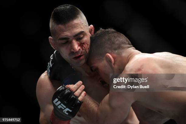 Ricardo Lamas grapples with Mirsad Bektic of Bosnia in the second round in their featherweight bout during the UFC 225: Whittaker v Romero 2 event at...