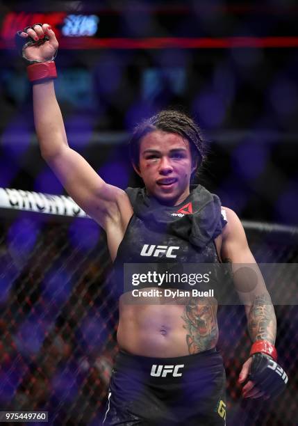 Claudia Gadelha of Brazil celebrates after her strawweight bout against Carla Esparza during the UFC 225: Whittaker v Romero 2 event at the United...