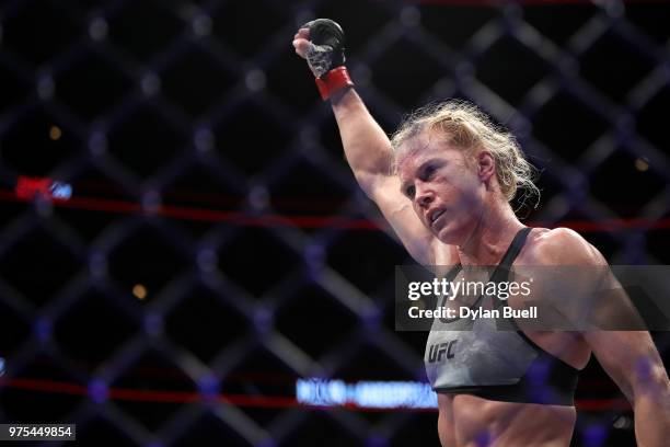 Holly Holm celebrates after her featherweight bout against Megan Anderson of Australia during the UFC 225: Whittaker v Romero 2 event at the United...