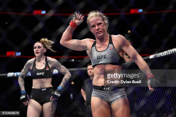 Holly Holm celebrates after her featherweight bout against Megan Anderson of Australia during the UFC 225: Whittaker v Romero 2 event at the United...