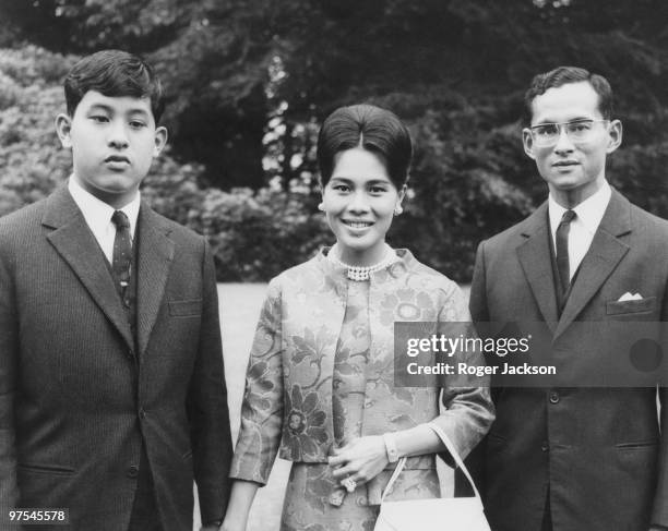 King Bhumibol and Queen Sirikit of Thailand at King's Beeches, their private residence in Sunninghill, Berkshire, 27th July 1966. On the left is...