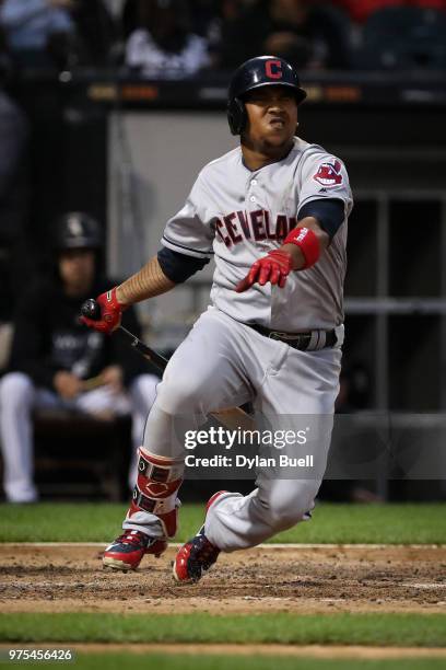 Jose Ramirez of the Cleveland Indians falls to the ground after fouling a pitch off his foot in the fourth inning against the Chicago White Sox at...