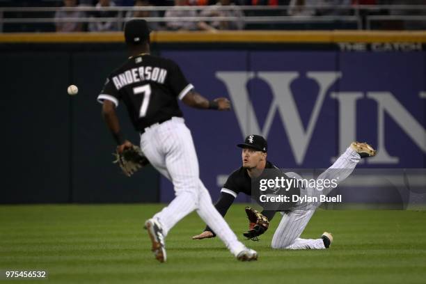 Adam Engel of the Chicago White Sox fails to catch a fly ball as Tim Anderson looks on in the fourth inning against the Cleveland Indians at...