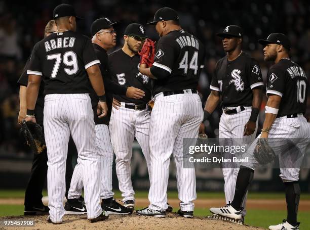 Manager Rick Renteria of the Chicago White Sox checks on Bruce Rondon in the eighth inning against the Cleveland Indians at Guaranteed Rate Field on...