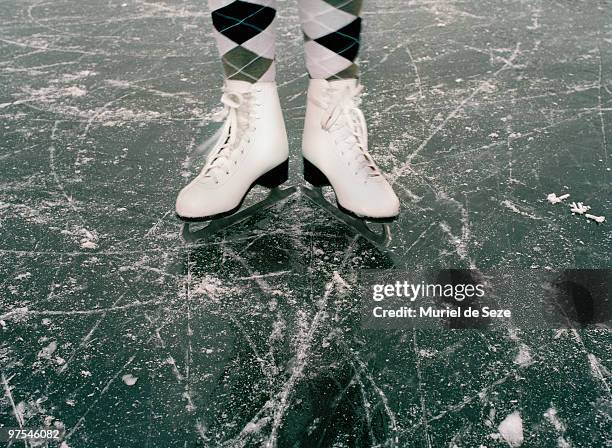 ice skates on ice - アイススケート ストックフォトと画像