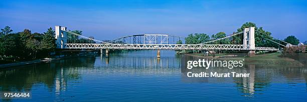 bridge spanning a river - waco stock pictures, royalty-free photos & images