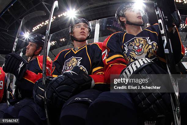 David Booth of the Florida Panthers sits between teammates Stephen Weiss and Michael Frolik against the Philadelphia Flyers at the BankAtlantic...