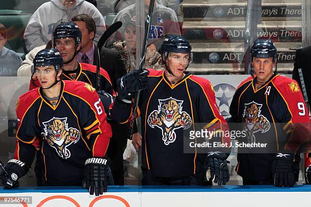 David Booth of the Florida Panthers stands between teammates Michael Frolik and Stephen Weiss between shifts against the Philadelphia Flyers at the...