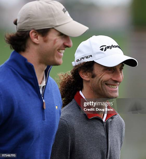Super Bowl winning quarterback Drew Brees of the New Orleans Saints and Grammy winning musician Kenny G walk down the fairway after hitting their tee...