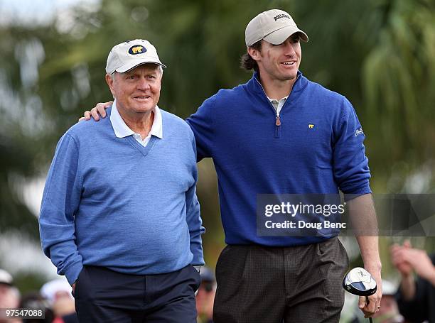 Tour legend Jack Nicklaus, L, and Super Bowl winning quarterback Drew Brees of the New Orleans Saints share a light moment after teeing off the first...