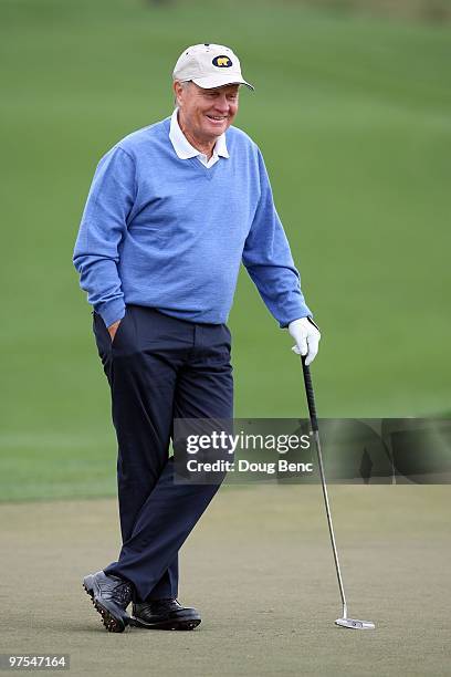 Tour legend Jack Nicklaus watches his teammates putt on the first hole during the Honda Classic Kenny G Gold Pro-Am at PGA National Resort And Spa on...