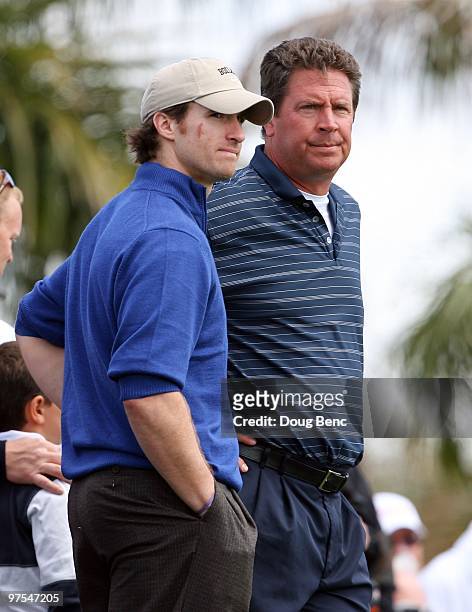 Hall-of-Fame NFL quarterback Dan Marino of the Miami Dolphins talks with Super Bowl winning quarterback Drew Brees of the New Orleans Saints before...