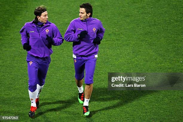 Alberto Gilardino warms up with team mate Riccardo Montolivo during a AFC Fiorentina training session at Artemio Franchi Stadium on March 8, 2010 in...