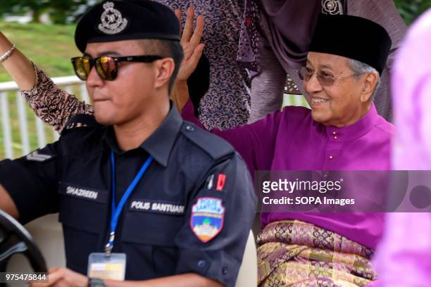 Malaysian Prime Minister Dr. Mahathir Mohamad seen in a buggy car at Pakatan Harapan government Aidilfitri open house held at Seri Perdana official...