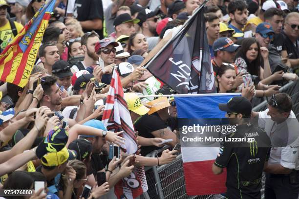 Johann Zarco of France and Monster Yamaha Tech 3 signs autographs for fans in pit during the pit walk during the MotoGp of Catalunya - Free Practice...