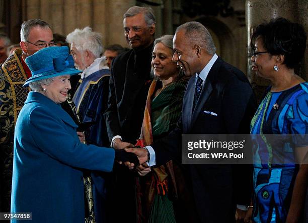 Queen Elizabeth II meets the Prime Minister of Trinidad and Tobago Patrick Manning and his wife Hazel, flanked by the Commonwealth Secretary-General...