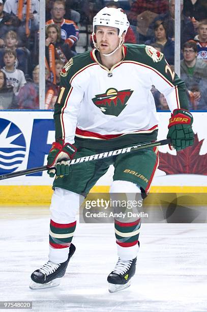 Kyle Brodziak of the Minnesota Wild follows the play against the Edmonton Oilers at Rexall Place on March 5, 2010 in Edmonton, Alberta, Canada. The...