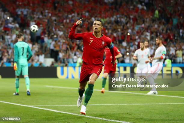 Cristiano Ronaldo of Portugal celebrates after scoring a penalty for his team's first goal during the 2018 FIFA World Cup Russia group B match...