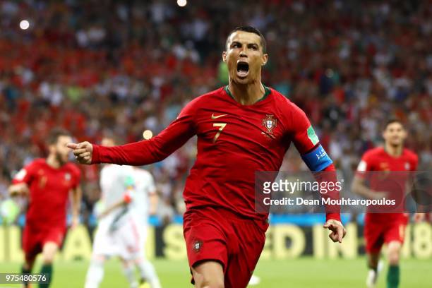 Cristiano Ronaldo of Portugal celebrates after scoring a penalty for his team's first goal during the 2018 FIFA World Cup Russia group B match...