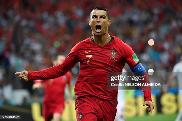 Portugal's forward Cristiano Ronaldo celebrates a goal after shooting a penalty kick during the Russia 2018 World Cup Group B football match between...