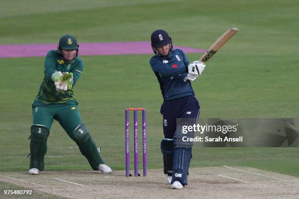 Sarah Taylor of England Women hits a boundary off her first ball as South Africa Women's wicket keeper Lizelle Lee looks on during the 3rd ODI of the...