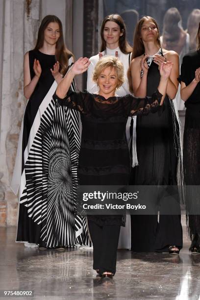 Designer Alberta Ferretti acknowledges the applause of the audience at the runway at the Alberta Ferretti show during Milan Men's Fashion Week...