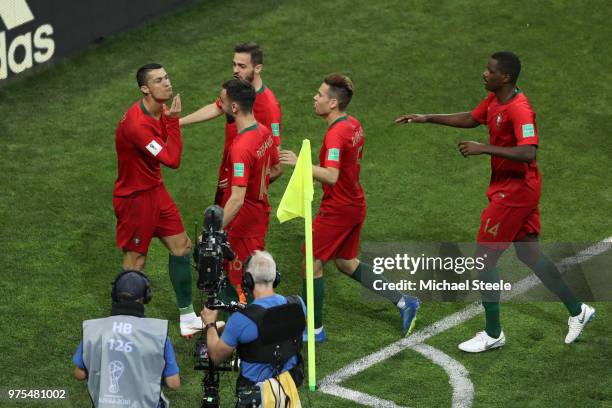 Cristiano Ronaldo of Portugal celebrates with teammates after scoring a penalty for his team's first goal during the 2018 FIFA World Cup Russia group...