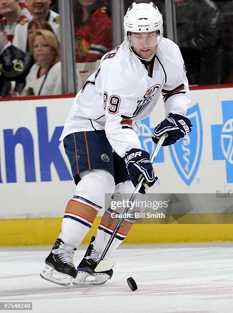 Sam Gagner of the Edmonton Oilers takes control of the puck during a game against the Chicago Blackhawks on March 03, 2010 at the United Center in...