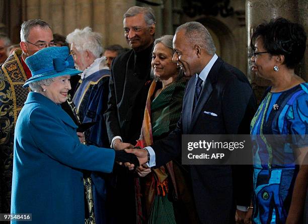 Britain's Queen Elizabeth, meets the Prime Minister of Trinidad and Tobago Patrick Manning, and his wife Hazel, , flanked by the Commonwealth...