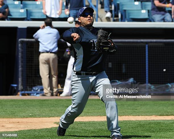 Catcher Dioner Navarro of the Tampa Bay Rays throws during batting practice before play against the New York Yankees March 5, 2010 at the George M....