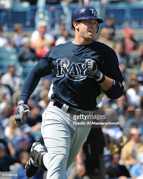 Infielder Evan Longoria of the Tampa Bay Rays runs to first base against the New York Yankees March 5, 2010 at the George M. Steinbrenner Field in...