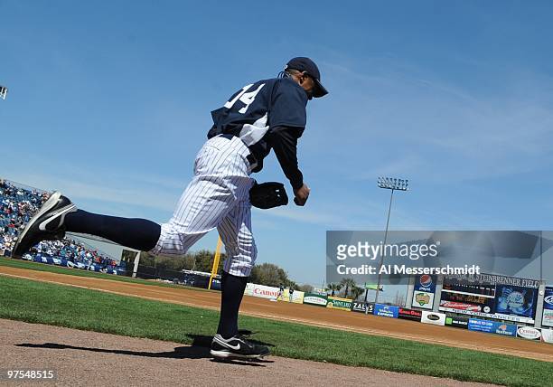 Outfielder Curtis Granderson of the New York Yankees takes the field before play against the Tampa Bay Rays March 5, 2010 at the George M....