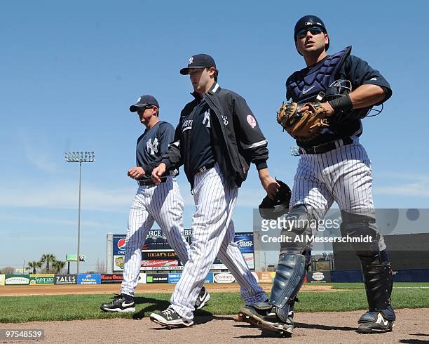 Pitcher Phil Hughes of the New York Yankees walks to the dugout before play against the Tampa Bay Rays March 5, 2010 at the George M. Steinbrenner...
