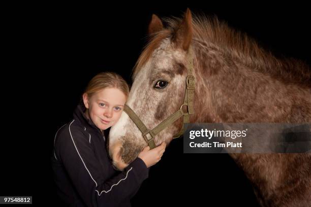 portrait of a young girl with a horse. - appaloosa horse stock pictures, royalty-free photos & images
