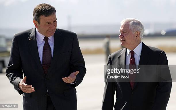 Secretary of Defense Robert Gates talks with US Ambassador to Afghanistan Karl Eikenberry as he arrives in Kabul March 8, 2010 in Kabul, Afghanistan....