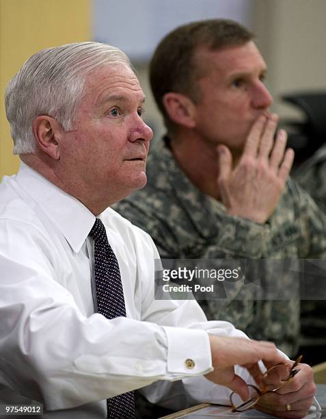 Secretary of Defense Robert Gates speaks with Commander of US and NATO forces in Afghanistan General Stanley McChrystal during a meeting March 8,...