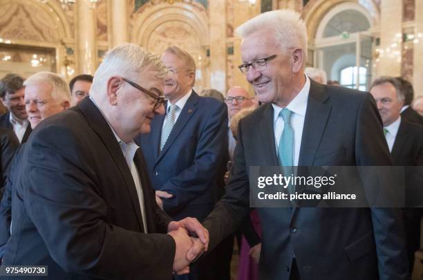 May 2018, Germany, Stuttgart: Premier of Baden-Wuerttemberg Winfried Kretschmann , and former German foreign minister Joschka Fischer pictured during...