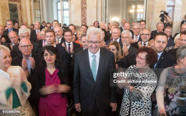 May 2018, Germany, Stuttgart: Premier of Baden-Wuerttemberg Winfried Kretschmann , standing with wife Gerlinde and Muhterem Aras , president of the...