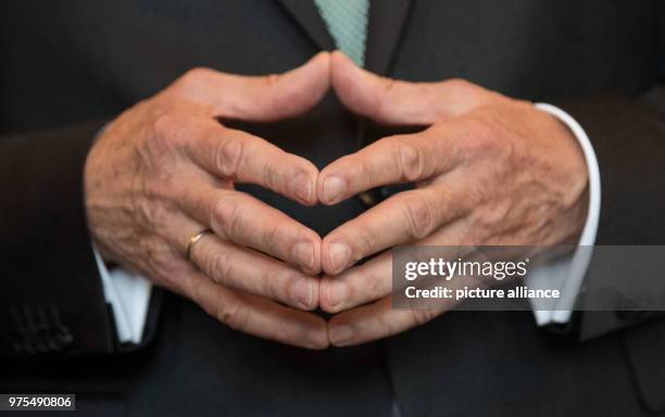 May 2018, Germany, Stuttgart: Winfried Kretschmann , premier of Baden-Wuerttemberg, holds his hands together during a reception marking his 70th...