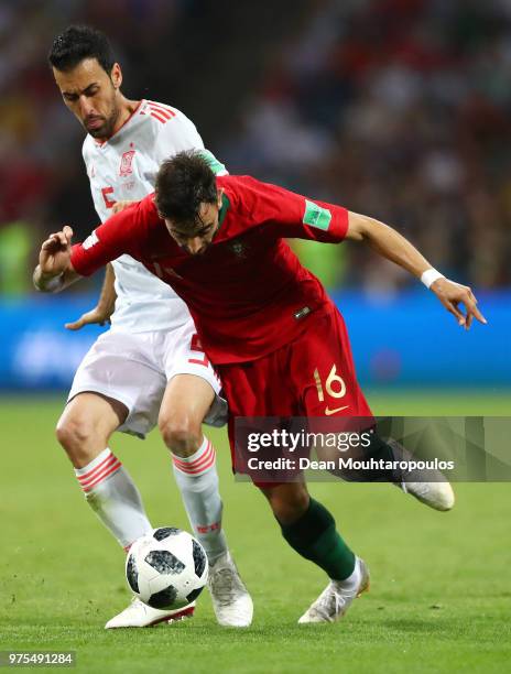 Sergio Busquets of Spain and Bruno Fernandes of Portugal battle for the ball the 2018 FIFA World Cup Russia group B match between Portugal and Spain...