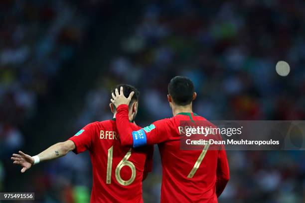 Cristiano Ronaldo of Portugal embraces team mate Bruno Fernandes during the 2018 FIFA World Cup Russia group B match between Portugal and Spain at...