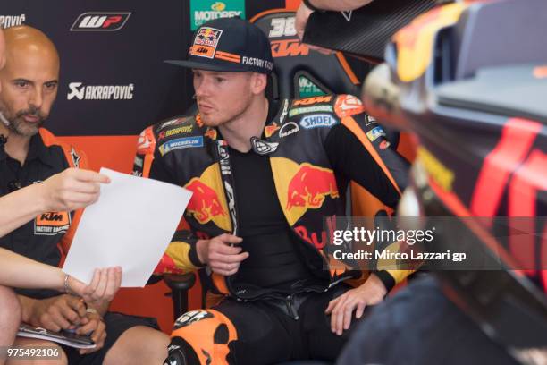 Bradley Smith of Great Britain and Red Bull KTM Factory Racing speaks in box with mechanics during the MotoGp of Catalunya - Free Practice at Circuit...