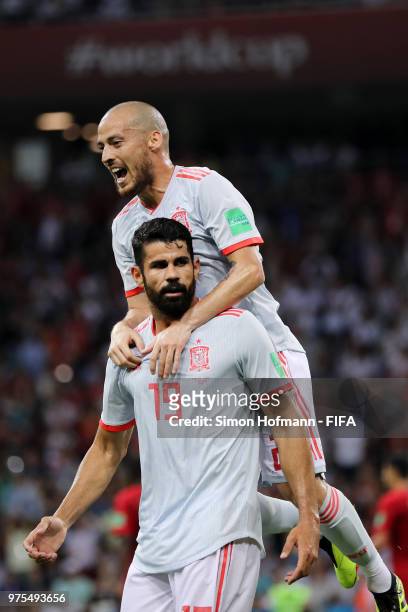 Diego Costa of Spain celebrates with team mate David Silva after scoring his team's first goal during the 2018 FIFA World Cup Russia group B match...