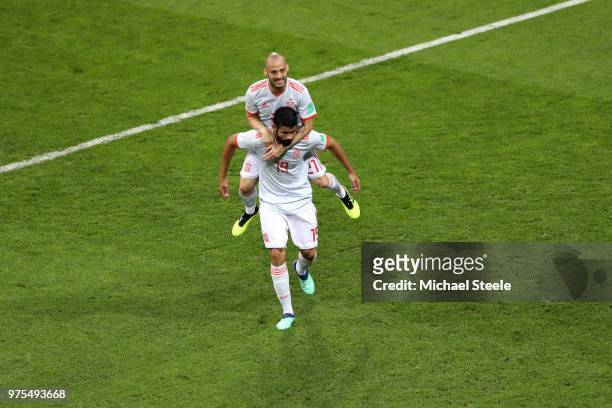 Diego Costa of Spain celebrates with team mate David Silva after scoring his team's first goal during the 2018 FIFA World Cup Russia group B match...