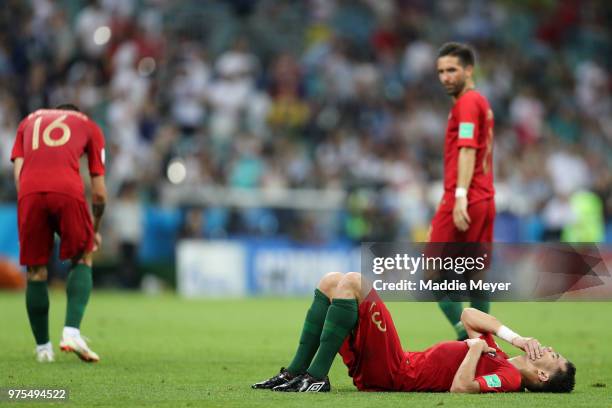 Pepe of Portugal goes down injured moments before Diego Costa of Spain scores Spain's first goal during the 2018 FIFA World Cup Russia group B match...